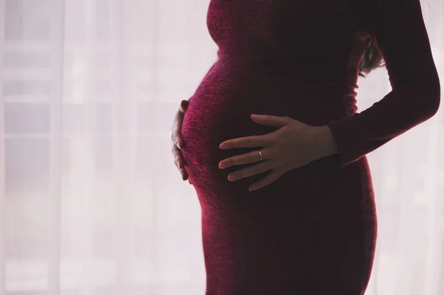 Pregnant woman in a red dress