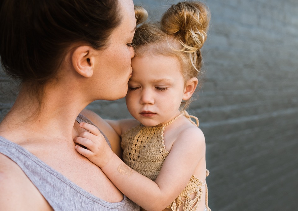 Mother hugging child