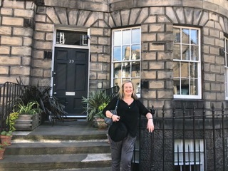 Cathleen Ross in front of Sir Walter's house