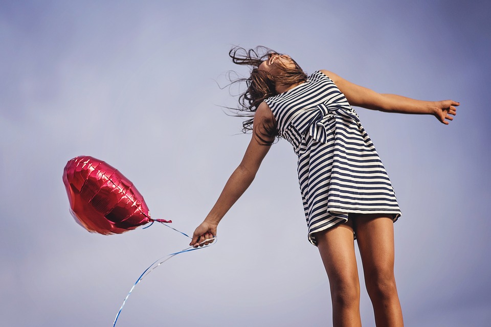 Happy girl with balloon