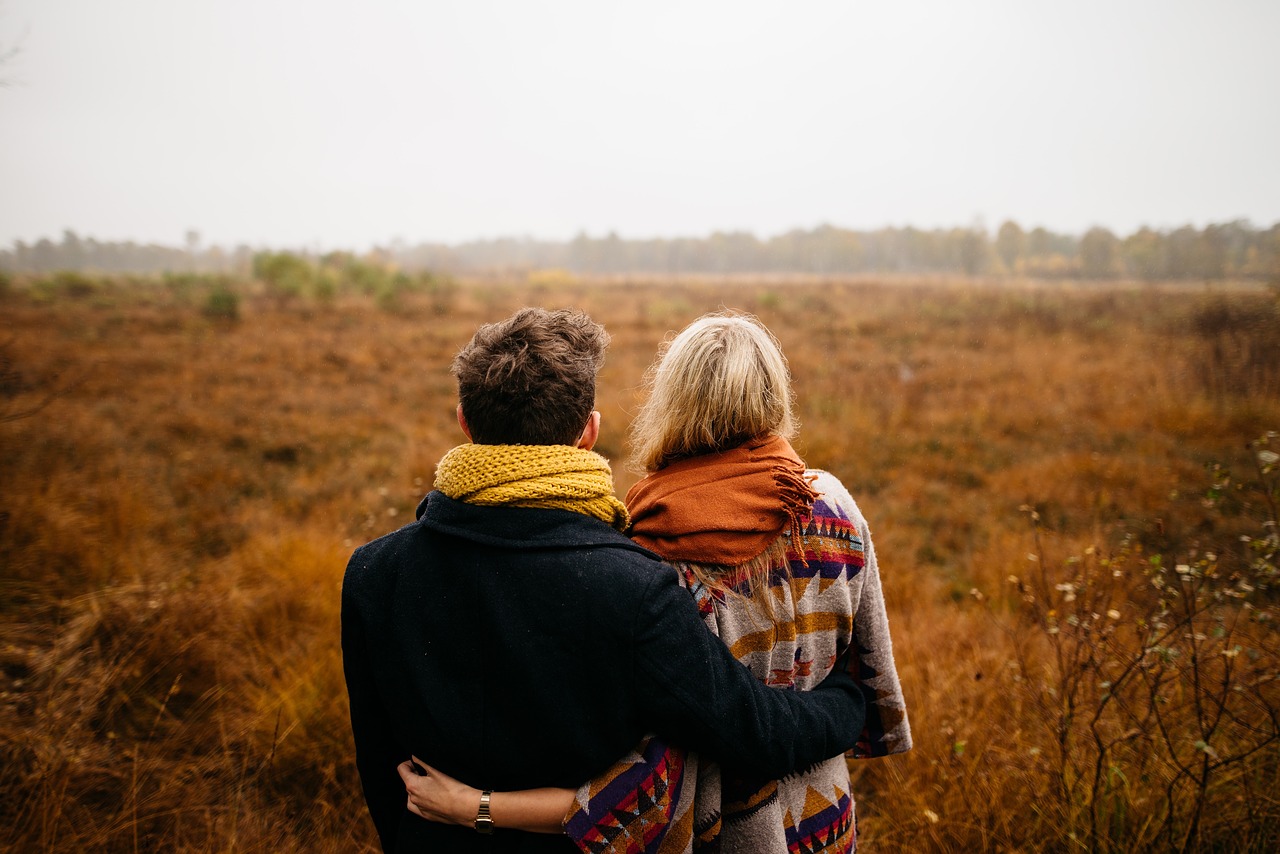 Couple hugging with fall colors