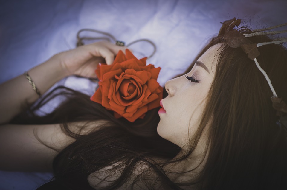 Girl sleeping with rose