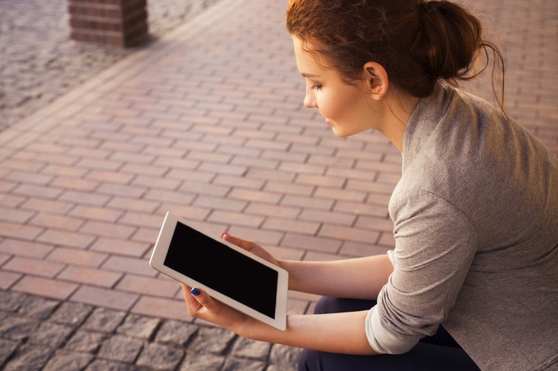 Girl reading on tablet