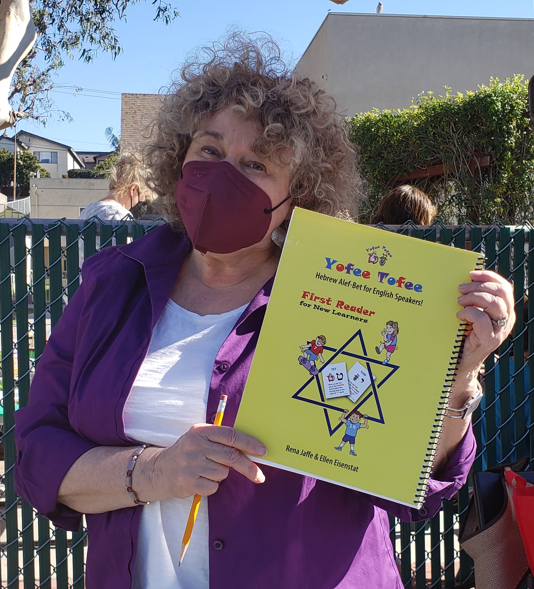 Morah Ellen holding Yofee Tofee book
