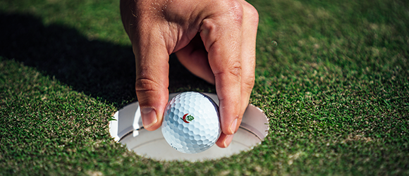 Image of woman golfing