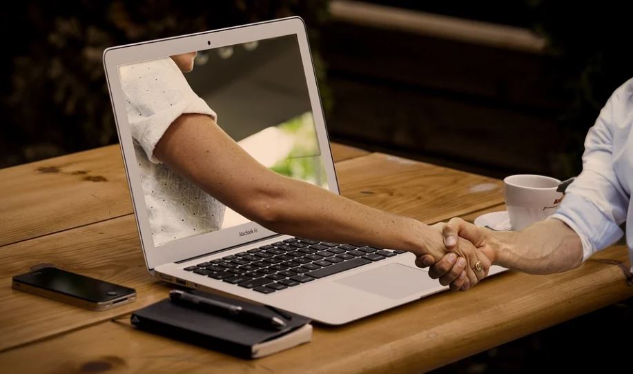 Shaking hands through computer