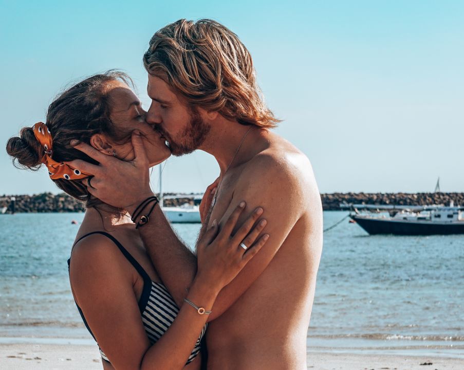 Couple kissing on beach
