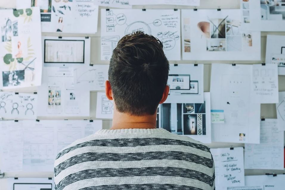 Man with research board