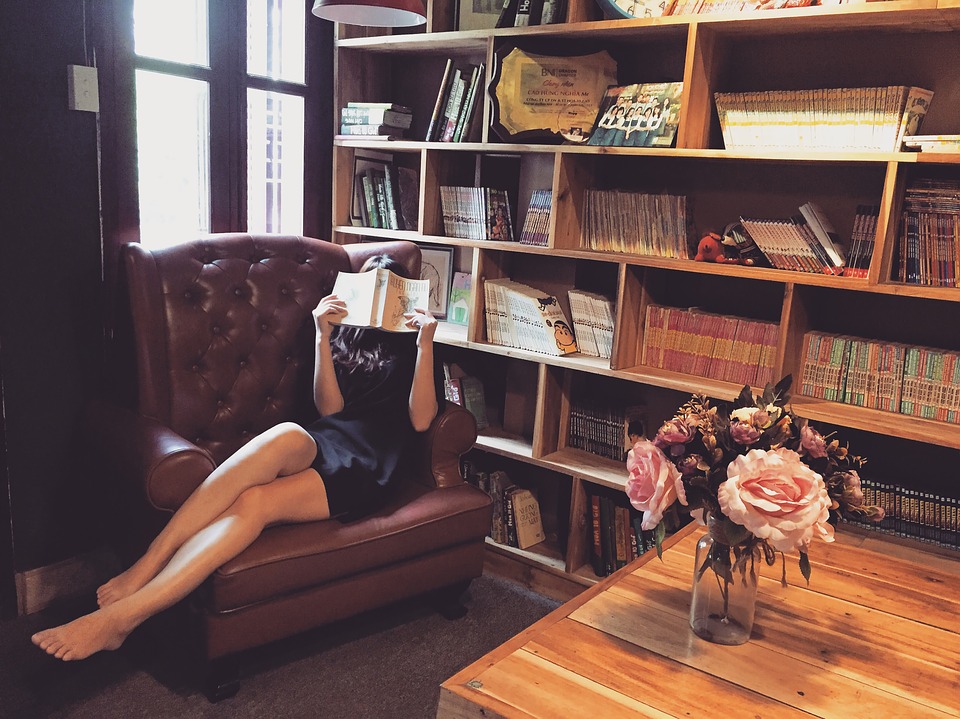 Girl reading on couch