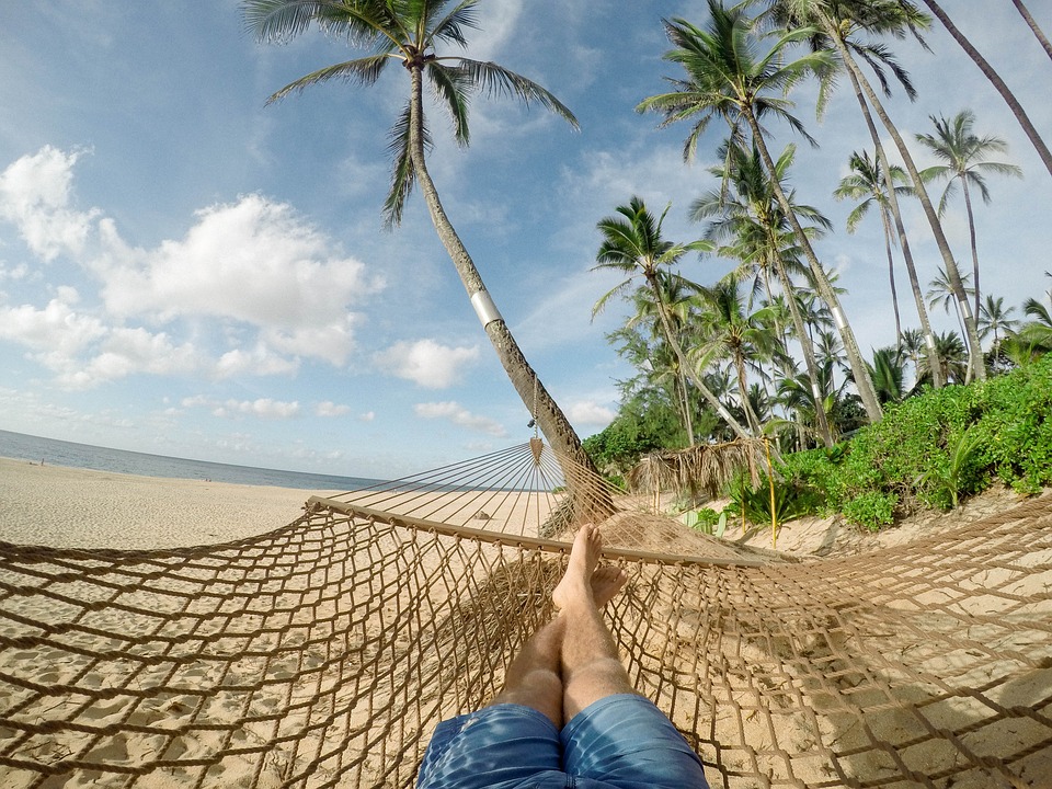 Lying on beach in hammock