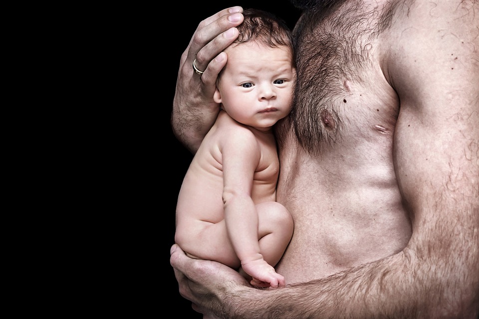 Baby on man's chest
