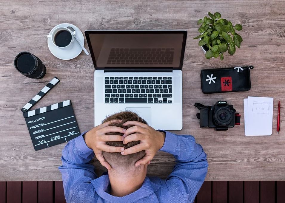 Man holding head frustrated