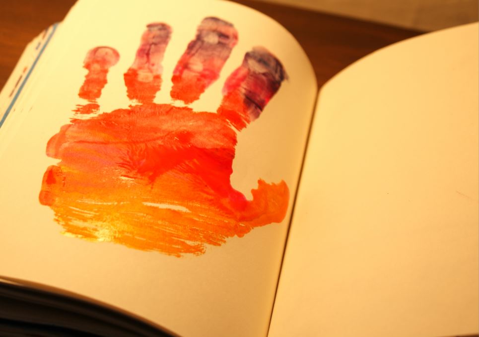 Hand print on book