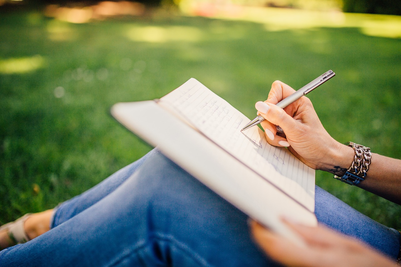 Girl writing on notebook