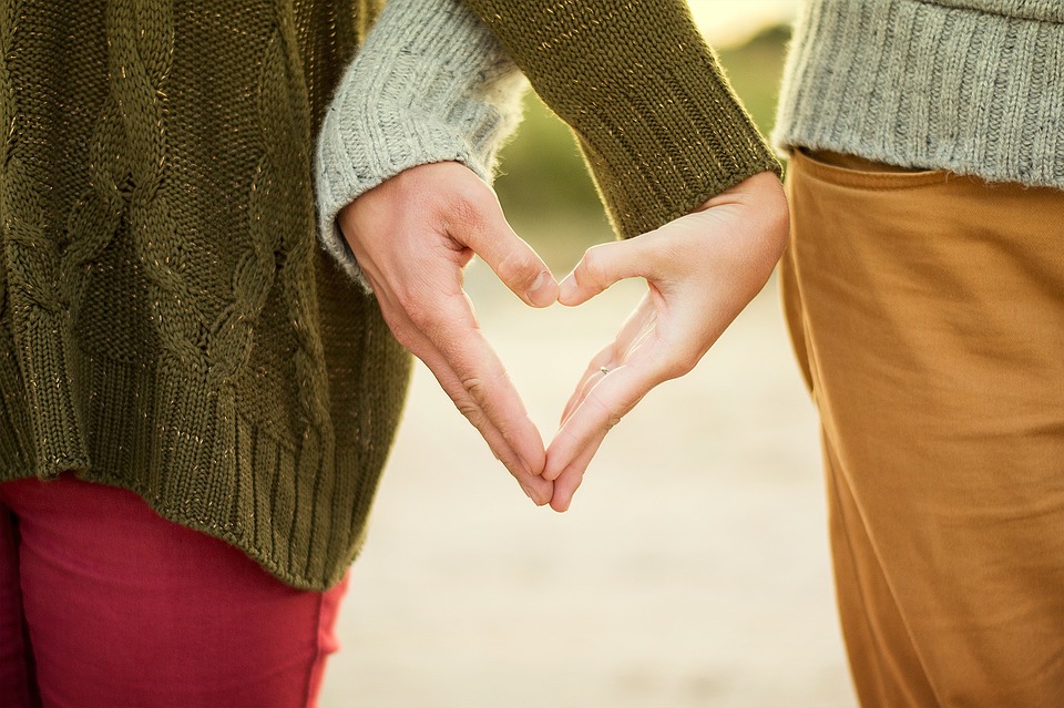 Couple with heart hands