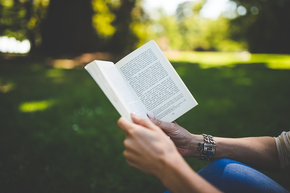 Hands holding book