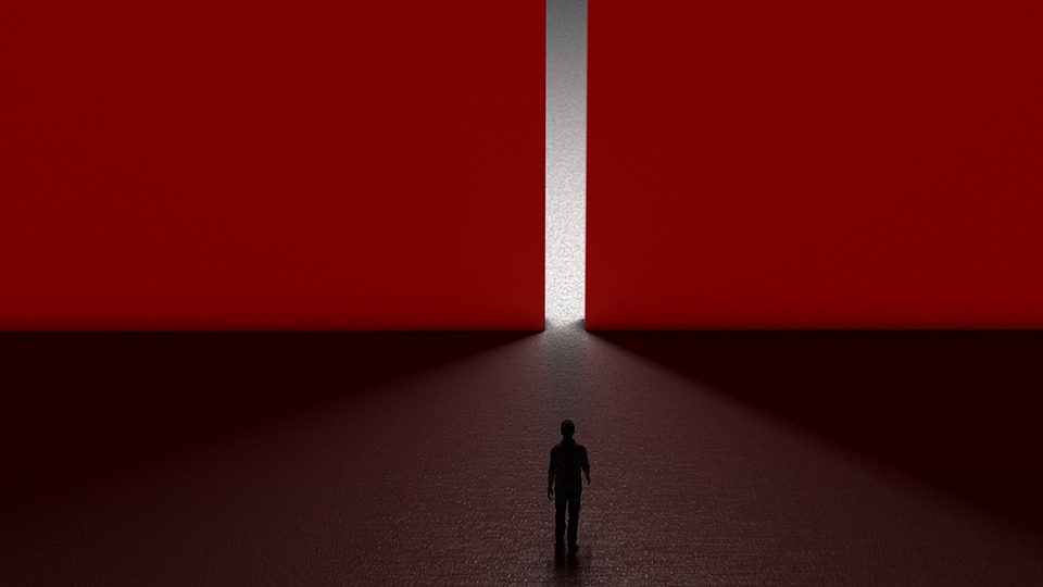 Man walking into red wall