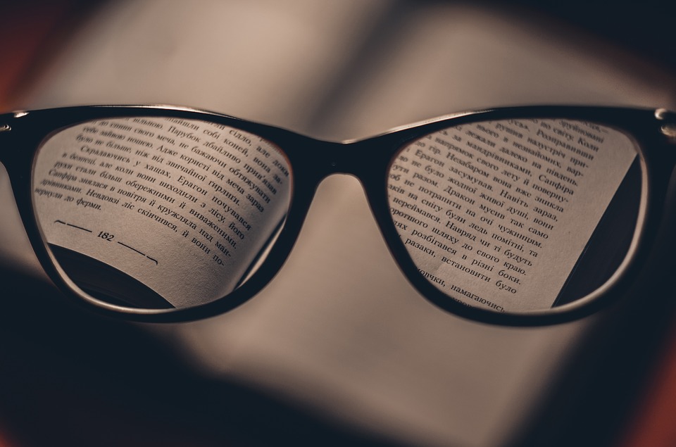 Reading glasses with book