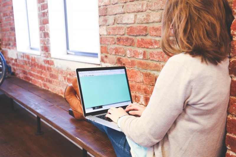 Girl typing on laptop