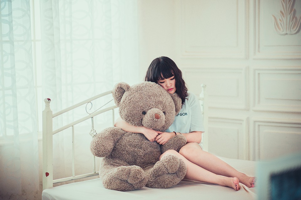 Girl hugging bear