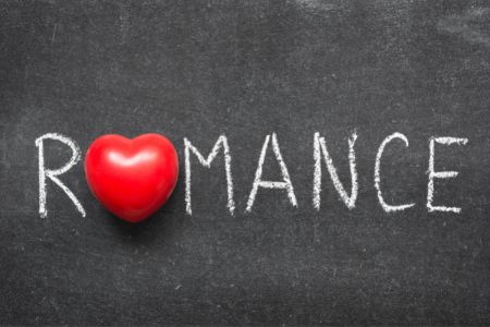 Romance on blackboard with red heart