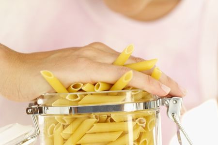 Cramming pasta into a jar