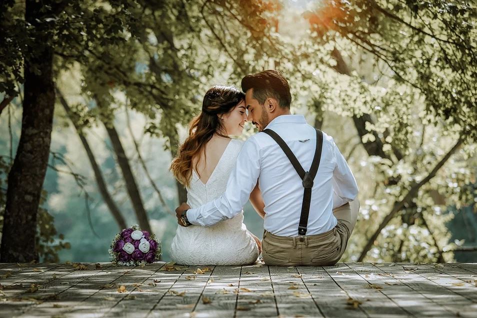 Couple with wedding bouquet