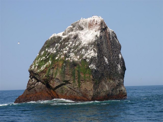 Which uninhabitable granite islet in the North Atlantic Ocean has ownership disputed by Britain and Ireland