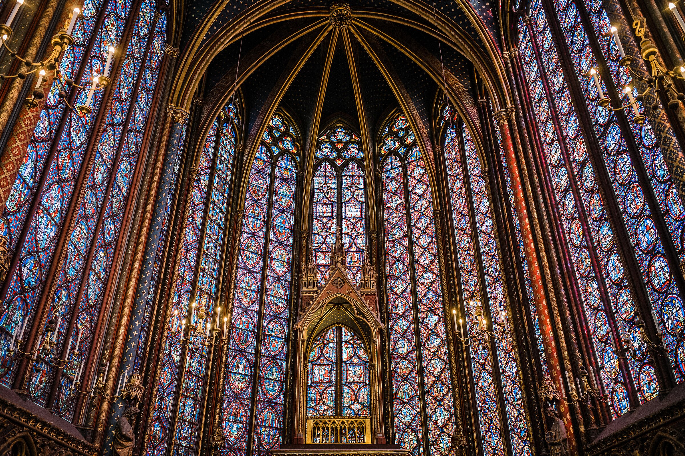 Interior of Sainte-Chapelle, Paris. Completed 1248. The upper chapel walls are almost entirely stained glass.