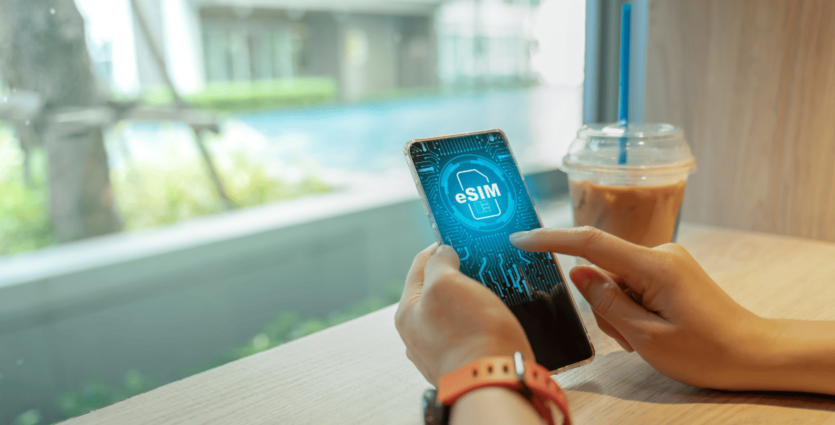 Illustration of a person holding a smartphone with eSIM display image on it