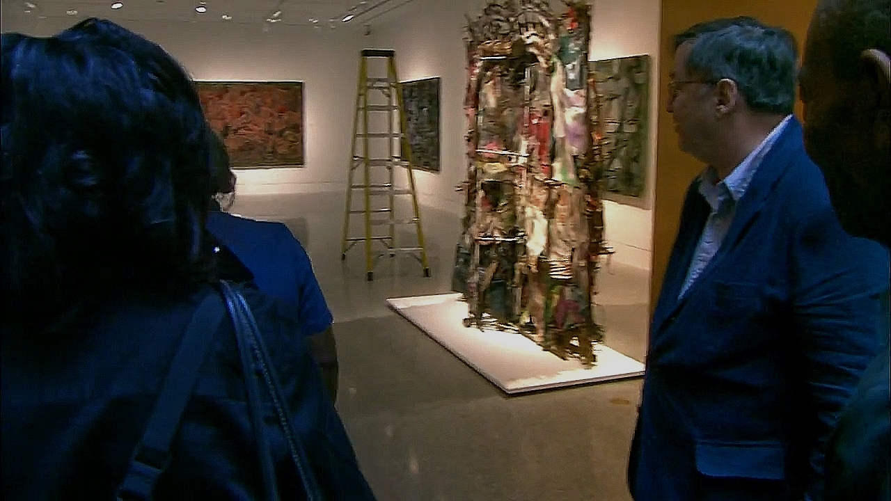 Figure 3: Dial’s History Refused to Die shown on the right side at the Museum of Fine Arts in Houston Texas, 2005. Video snapshot from Alabama Public Television.