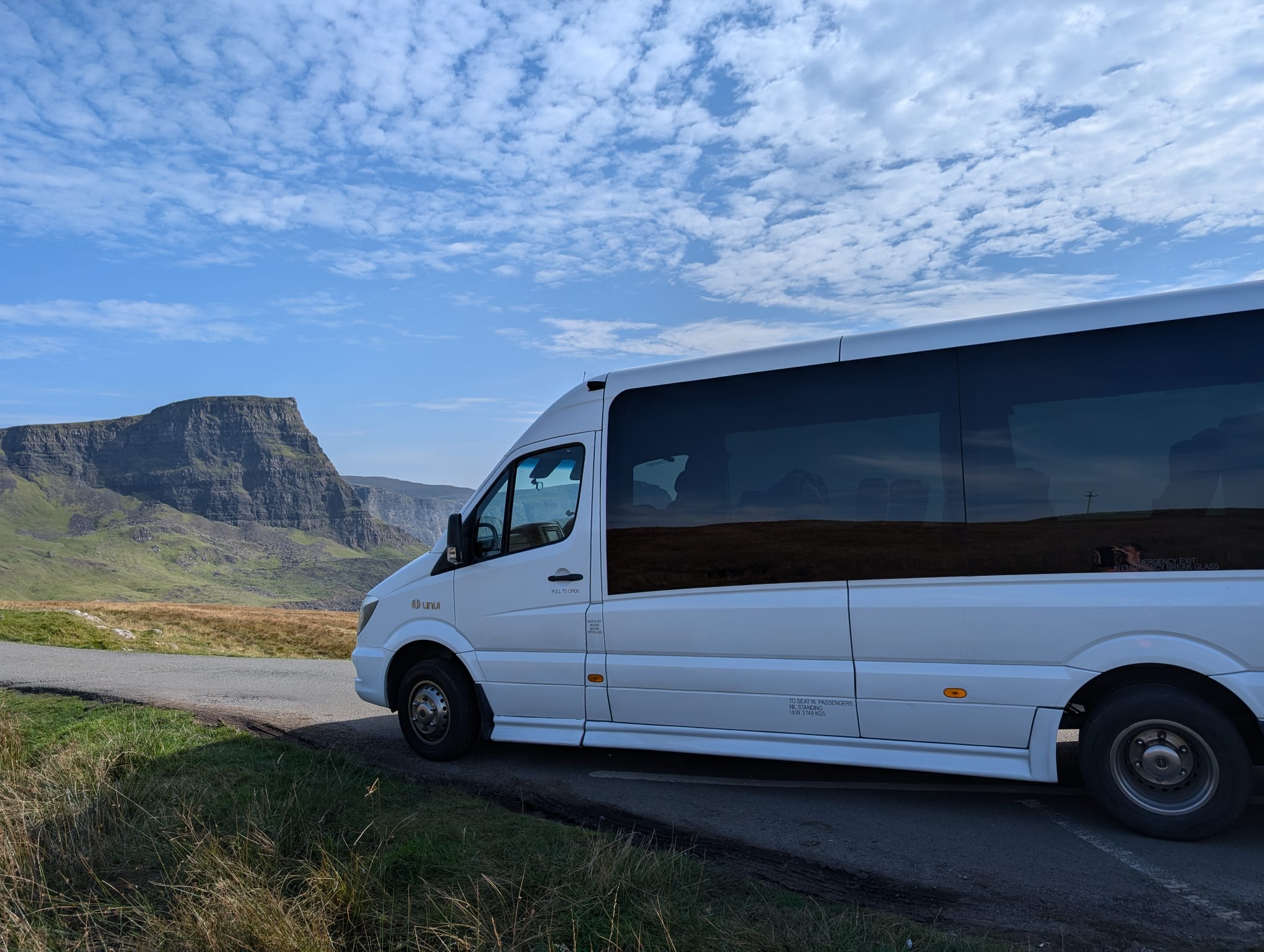 Minibus in a scenic Highland landscape