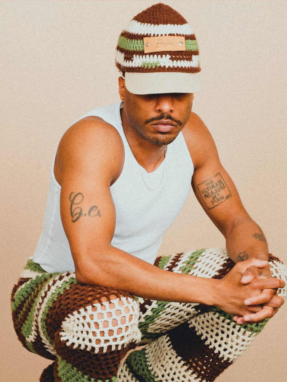 Byron wearing a crocheted cap