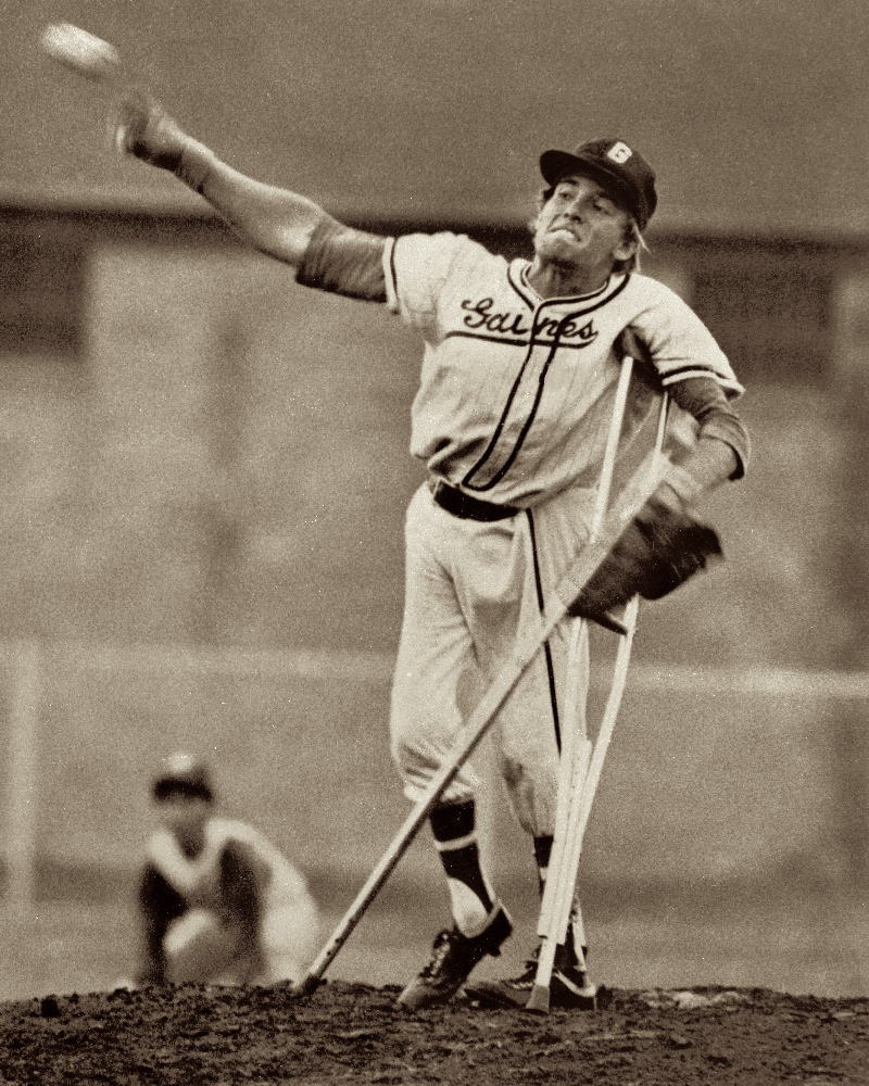Dave Clark pitching on crutches