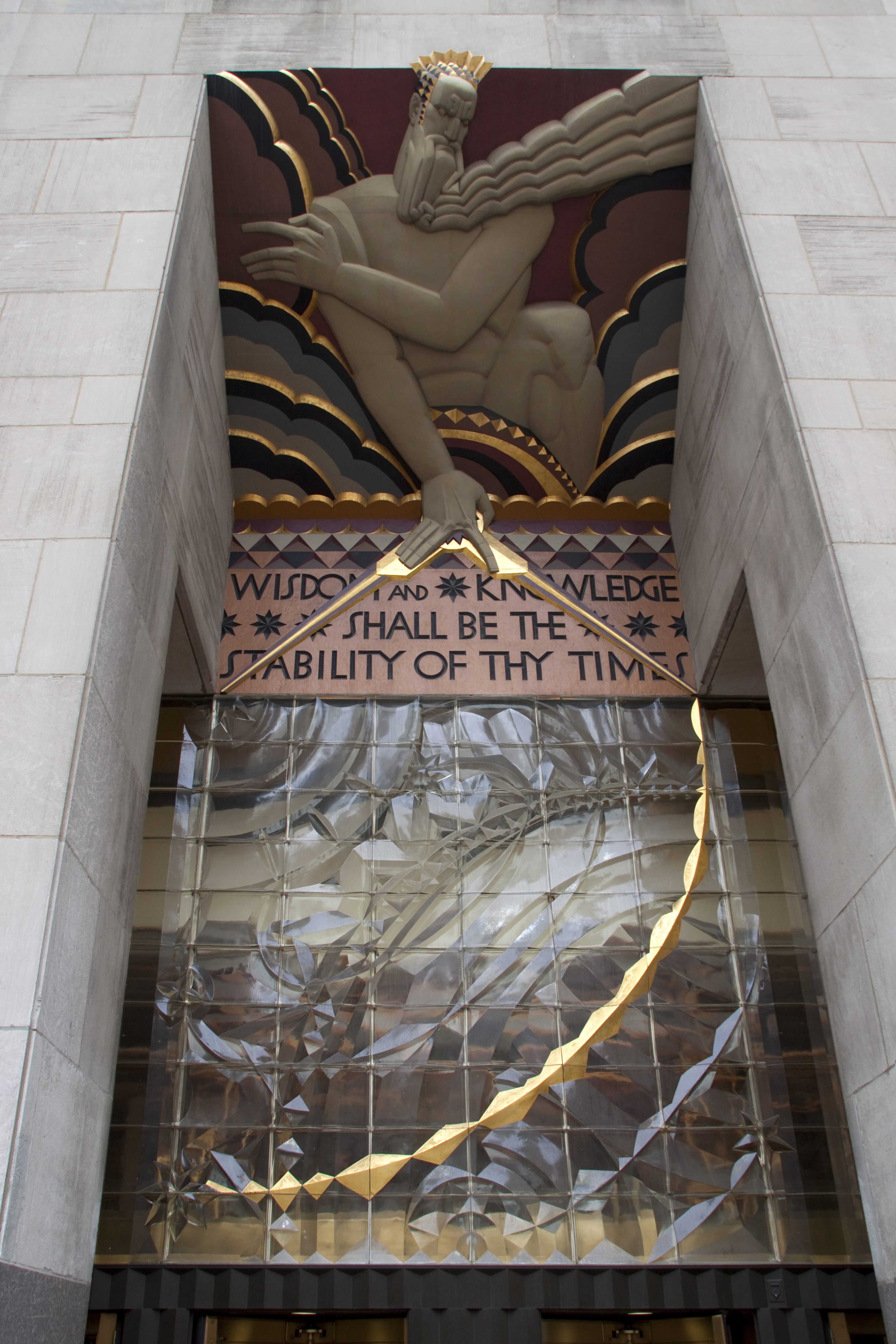 Wisdom, by Lee Lawrie, above the entrance to 30 Rockefeller Plaza, New York. Limestone and glass, 1933.