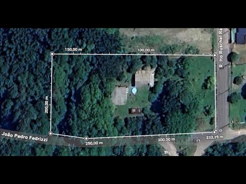 FRAÇÃO IDEAL DE 450m² DENTRO DE ÁREA MAIOR DE 6.923m² DO LOTE RURAL N° 36 DO TRAVESSÃO SANTA TERESA...
