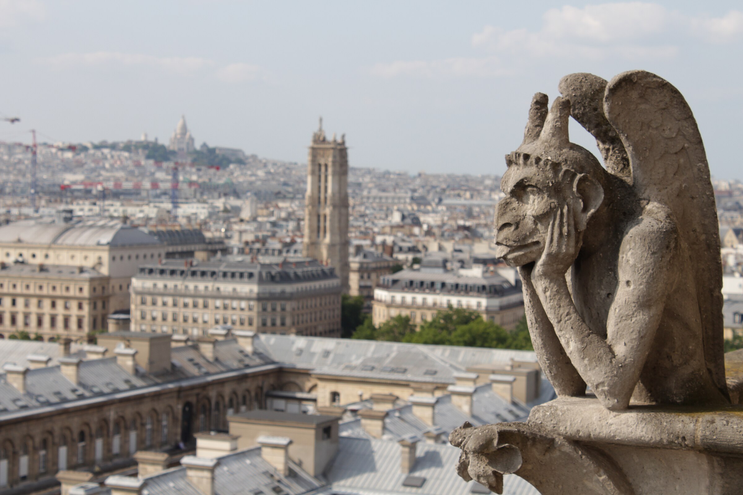 Le Stryge, the most famous chimera of Notre-Dame, overlooking Paris. Added during Viollet-le-Duc's 19th-century restoration.