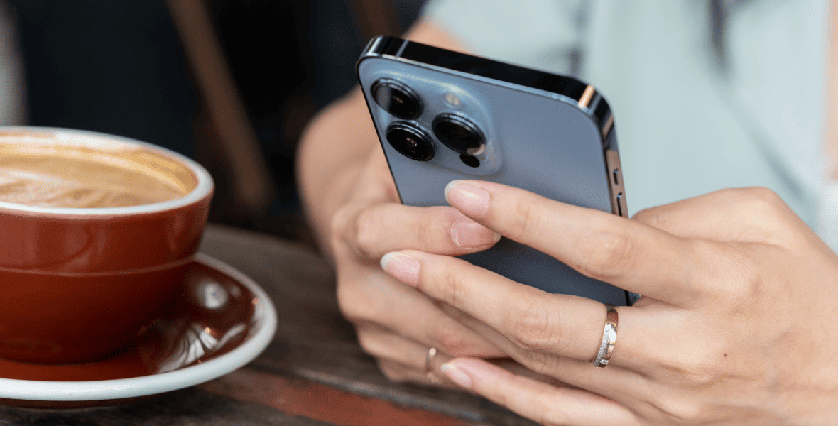 A lady holding an iPhone