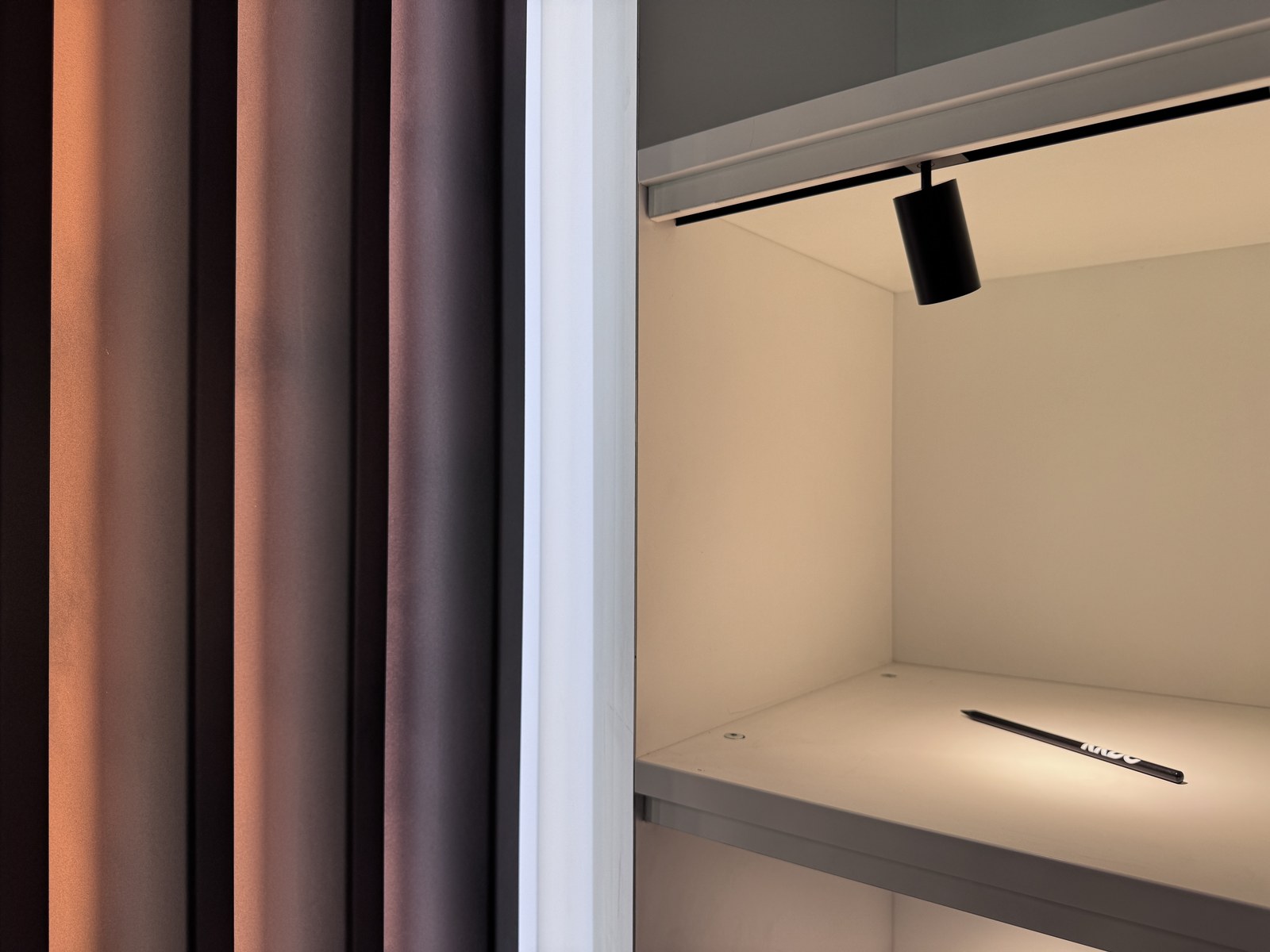 Mini Magnet — shelf accent lighting, pen detail