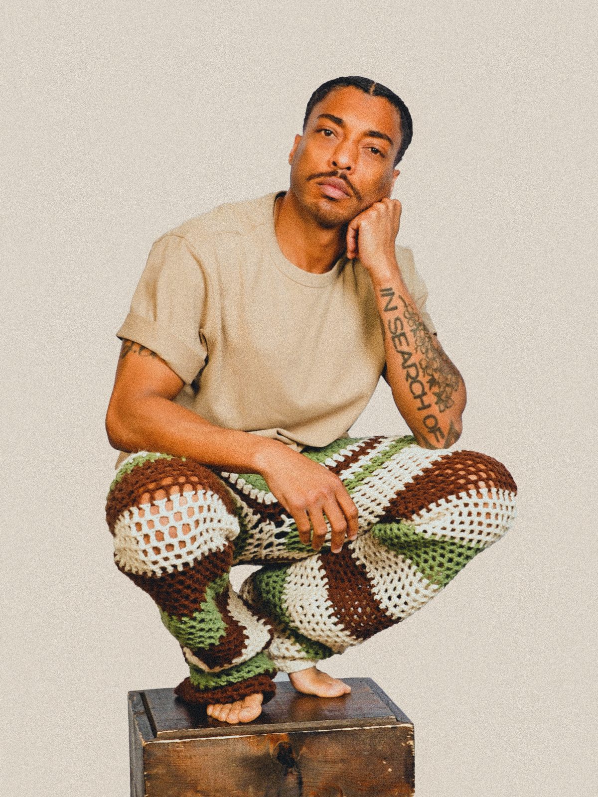 Byron wearing crocheted pants