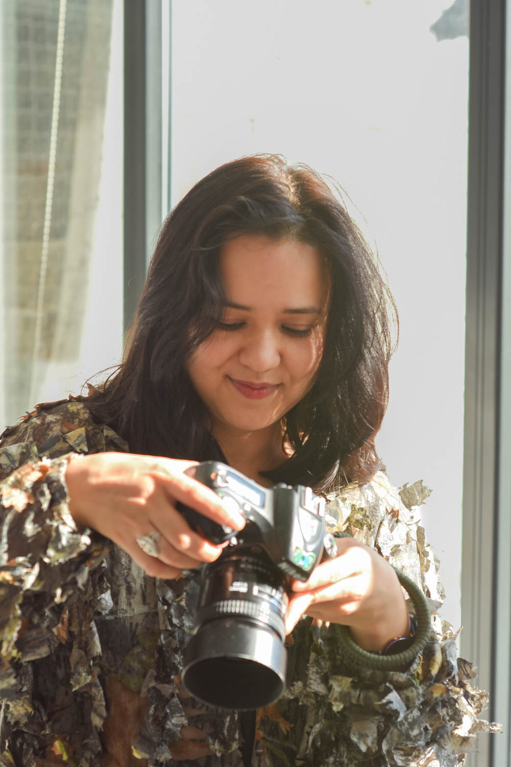 Jennifer Carmelo holding a camera