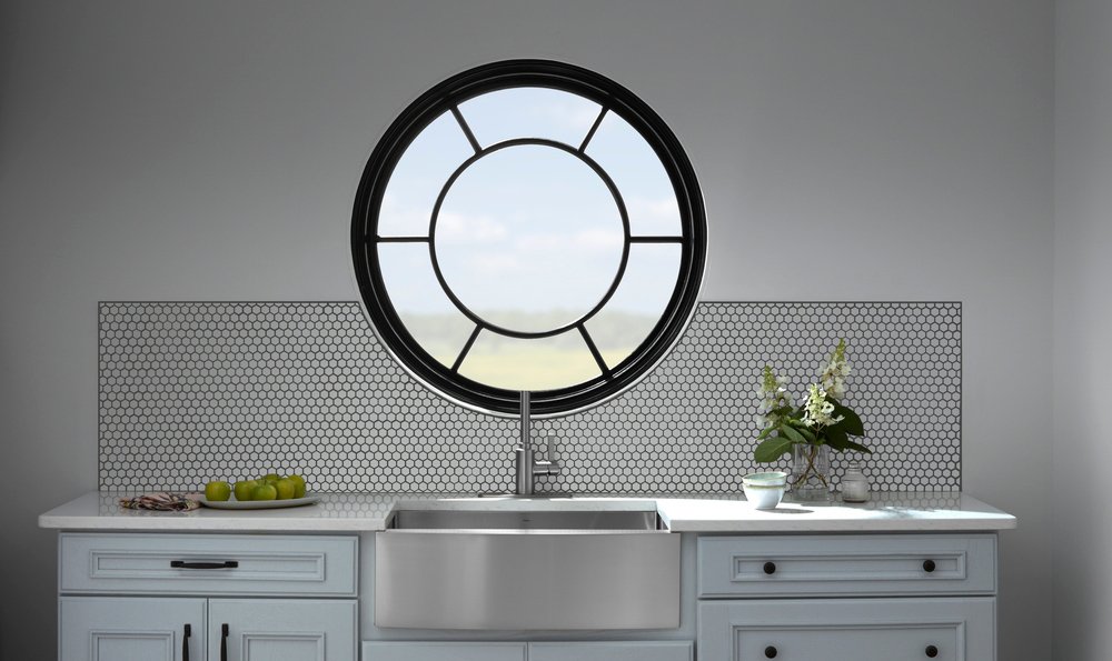 Where in the body would you find the round window and the oval window?