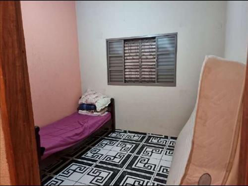 LOTE 001        Parte Ideal (50%) Terreno com benfeitorias...
