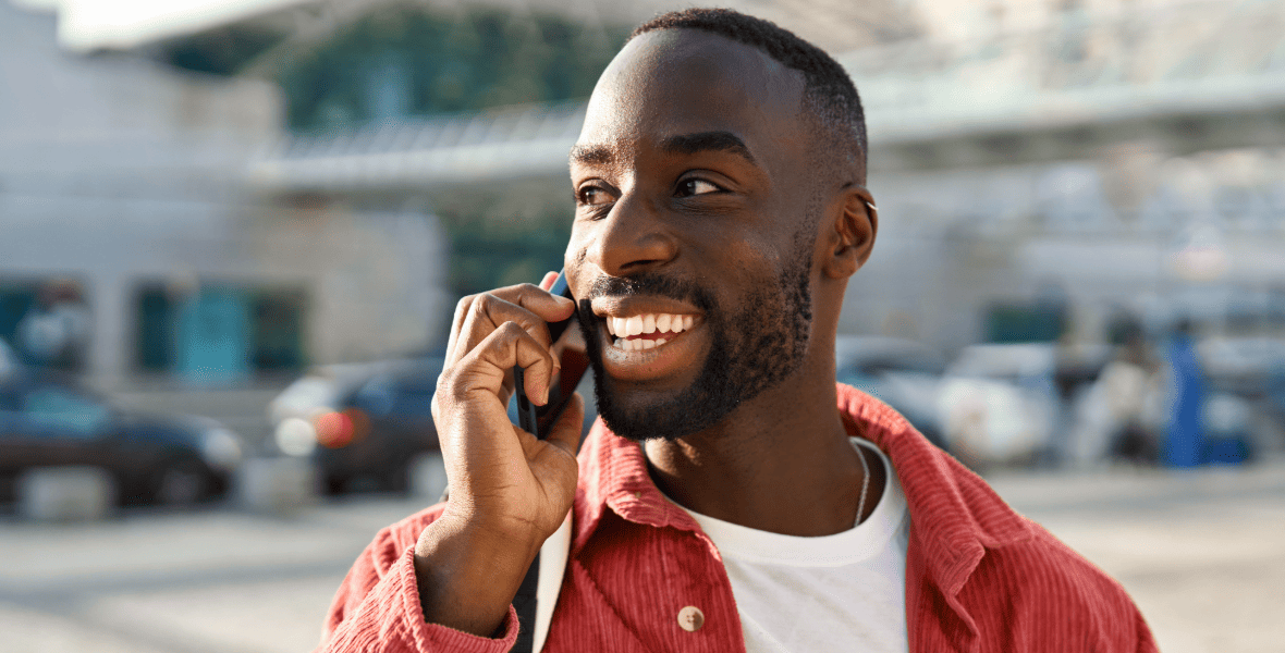 a black man talking on the phone